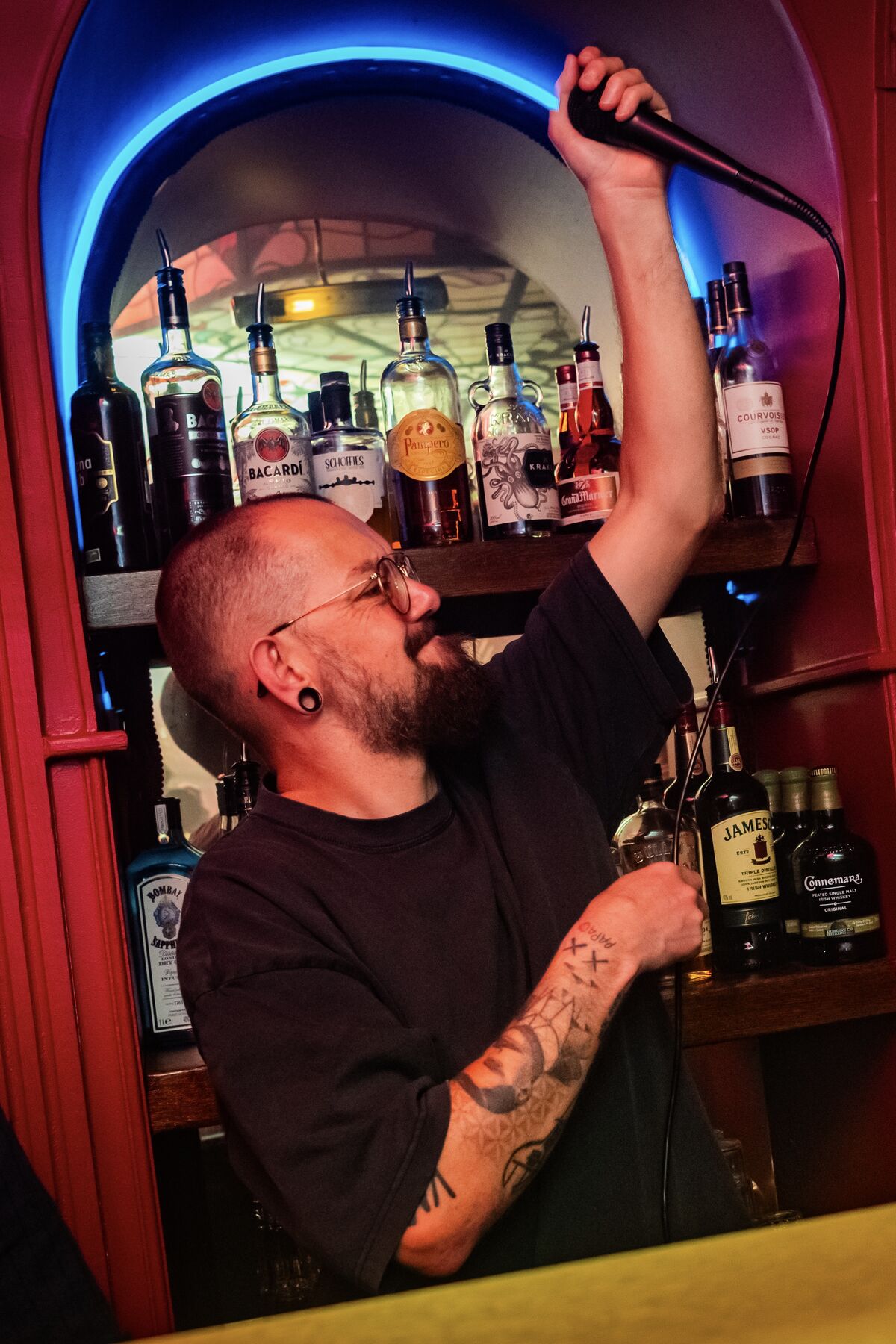 Grabbing the mic behind the bar