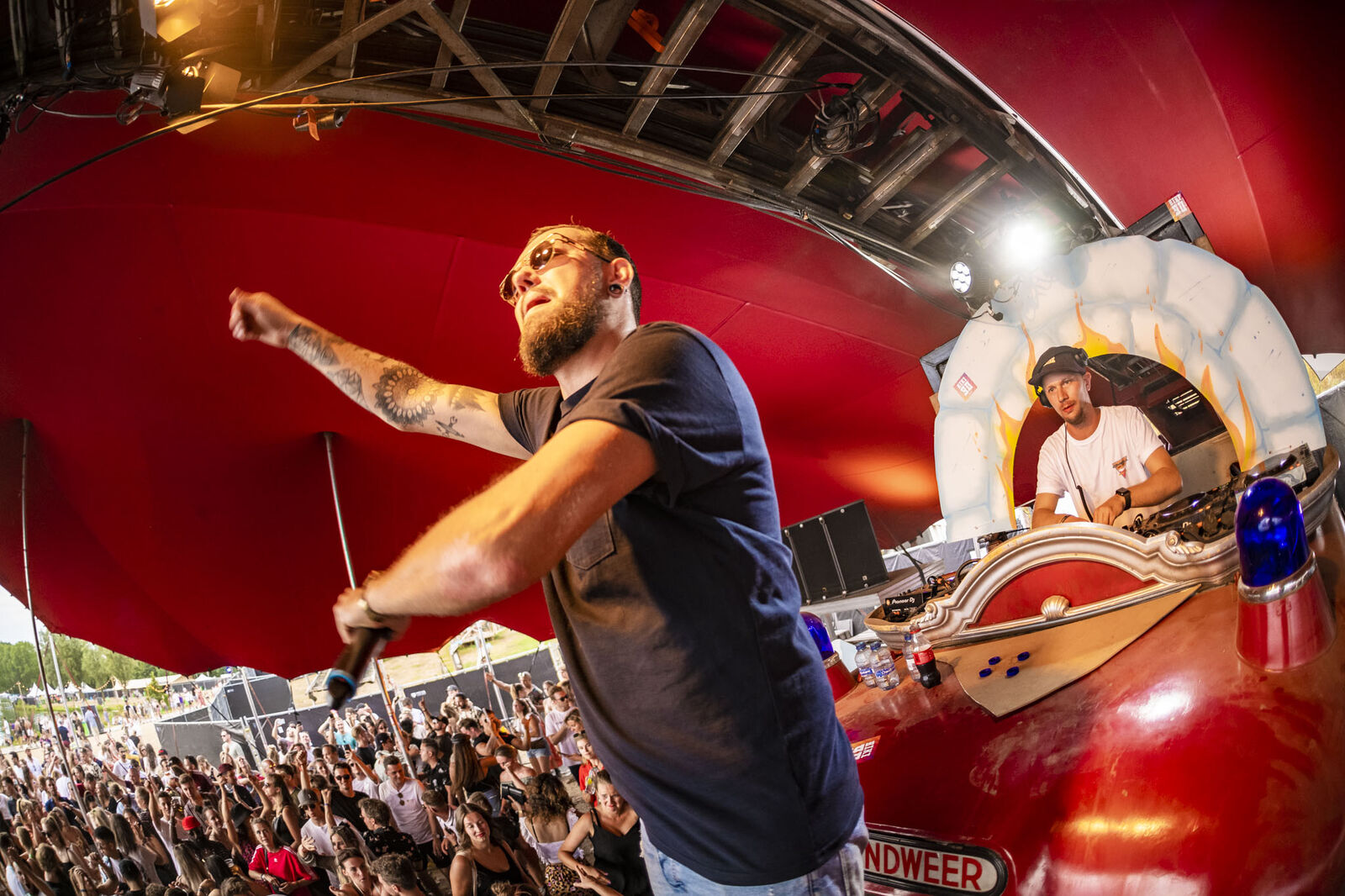 MC on stage at an outdoor festival